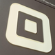 Sign with logo at the headquarters of mobile payment company Square in the South of Market (SoMa) neighborhood of San Francisco
